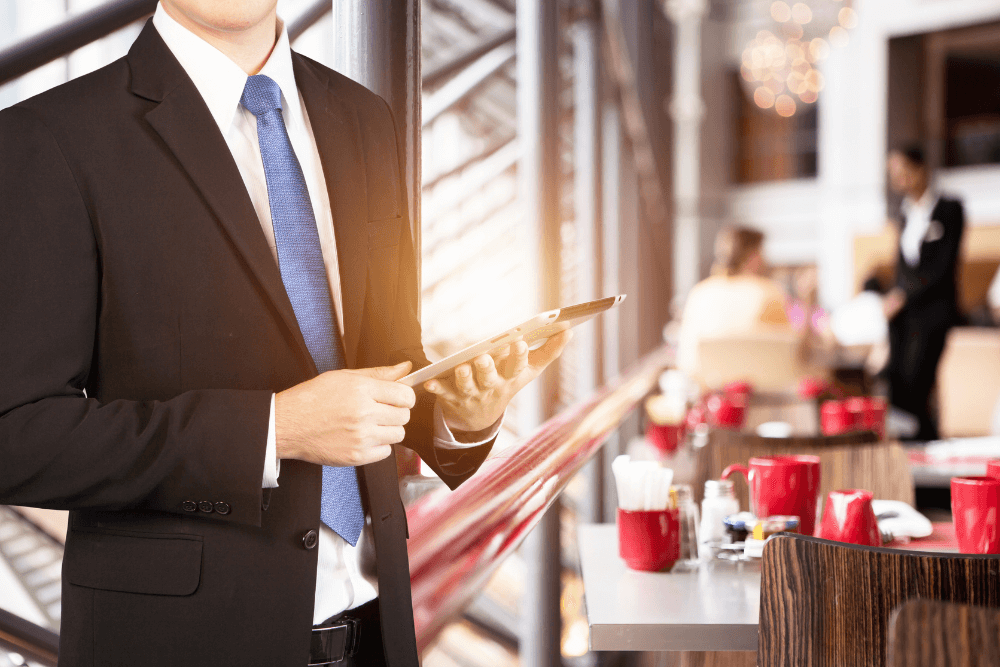 restaurant manager holding tablet