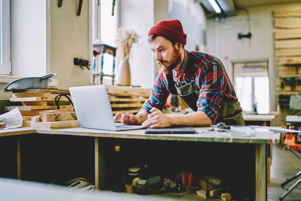 young man taking a course on carpentry