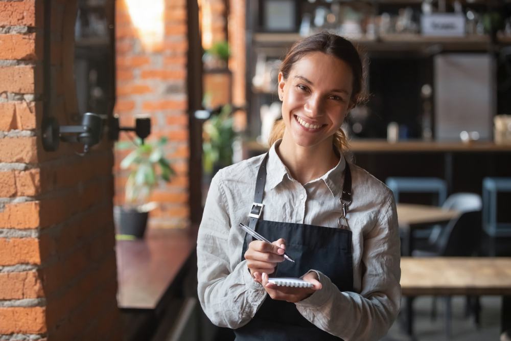 Customer service representatives smiling while working