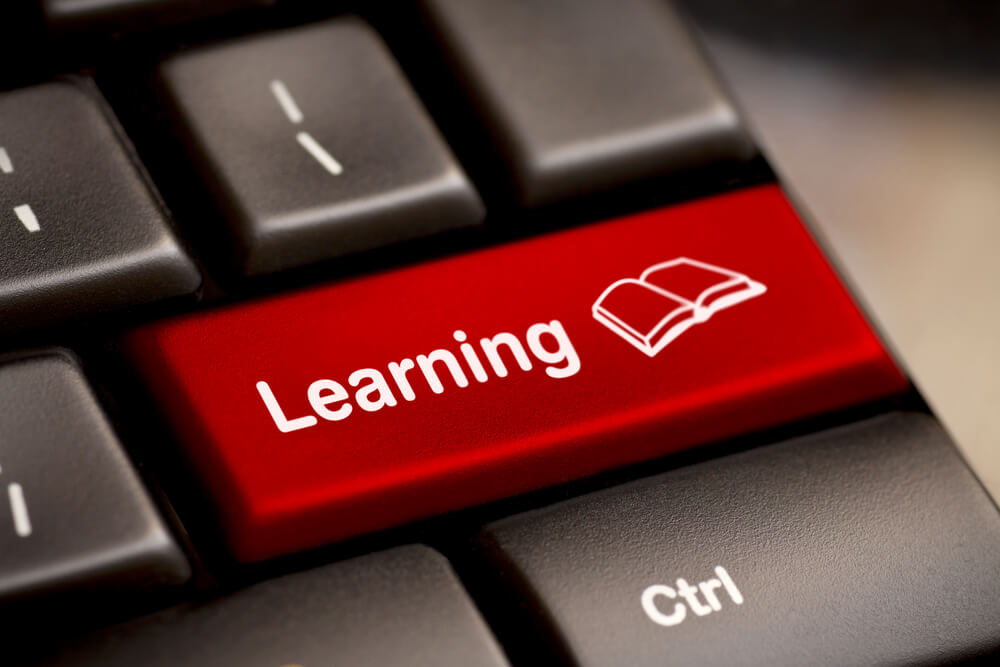 The word learning printed on the keyboard demonstrating e-learning concept