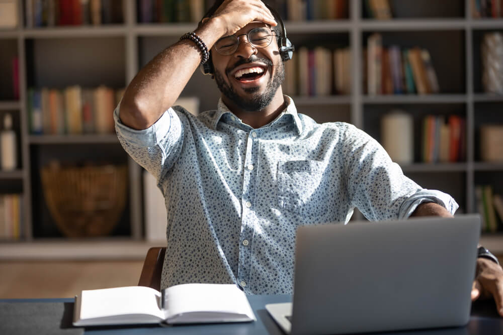 A modern student having fun during an online class