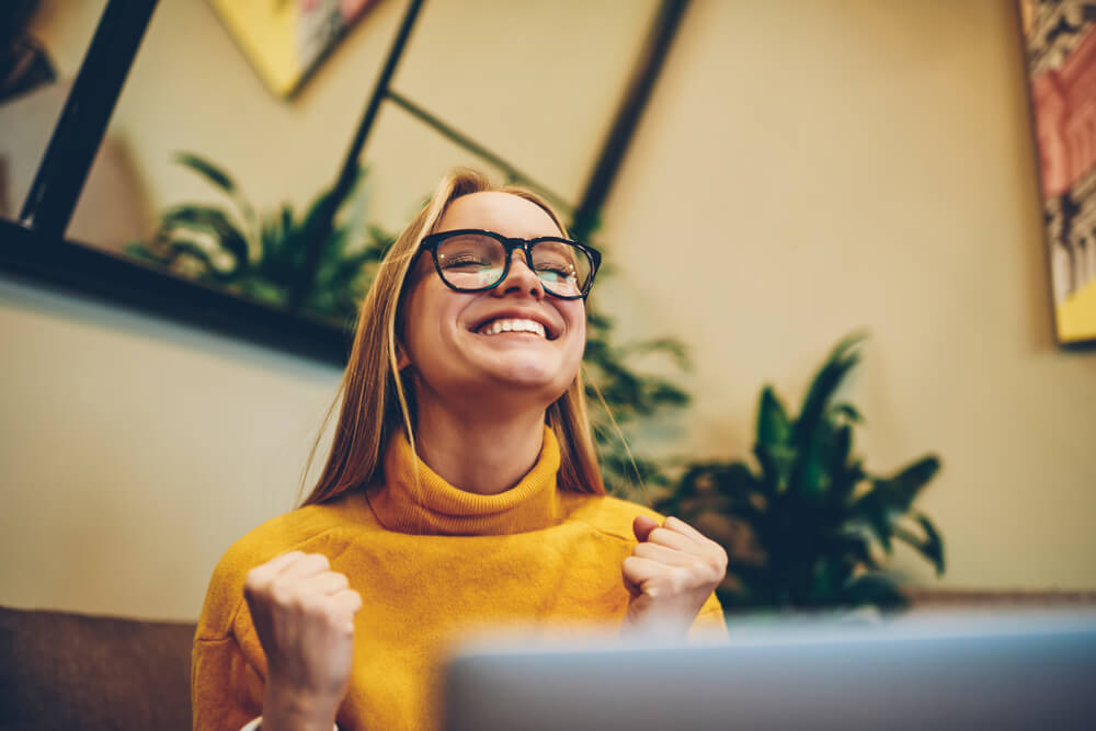 happy woman completing online course